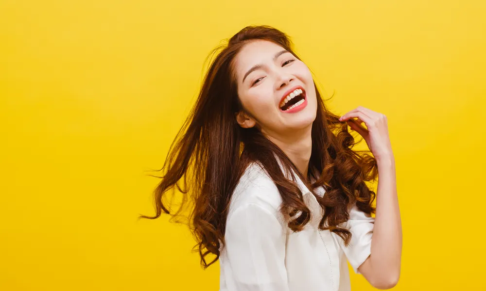 happy-excited-young-funny-asian-lady-listening-music-dancing-casual-clothing-yellow-wall-human-emotions-facial-expression-studio-portrait-lifestyle-concept